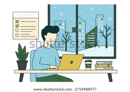 Man working on laptop in winter office, snow outside.