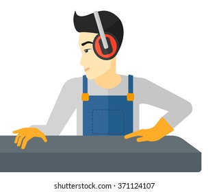 Man working on steel-rolling mill.
