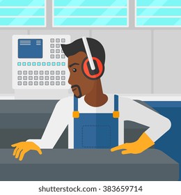 Man working on steel-rolling mill. Man working on steel-rolling mill.