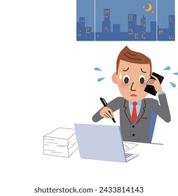 A man working overtime while talking on the phone at work
​