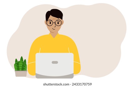 A man is working or studying at a laptop. Freelancing or distance learning and work concept.