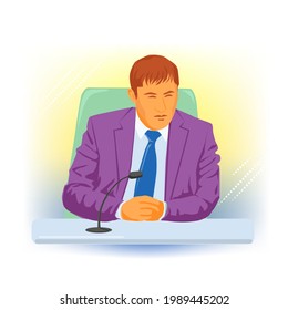 man working at a table with a microphone