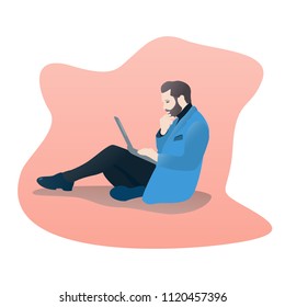 a man works at a laptop sitting on the floor. the man thought of a laptop.