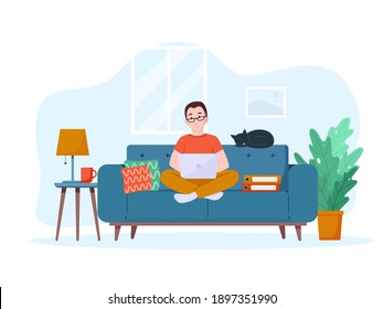 A man works on a laptop on the couch. Work from home concept. Freelance concept.