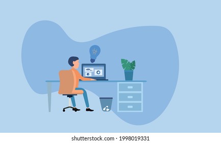 man works while sitting at a laptop next to a light bulb icon as a symbol of an idea