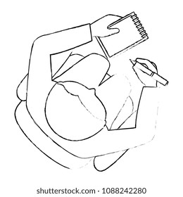 man writing in office notebook with pen