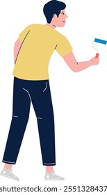 A man in a yellow shirt is painting a wall with a blue and white paintbrush