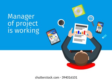 Manager of project is working with flat phones, tablets and infographics