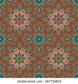Mandala doodle drawing. Colorful floral seamless ornament. Ethnic solar Arabic motifs. Zentangle. Green, blue, bright orange color. Vector