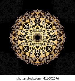 Mandala. Gold round ornament pattern on black background.