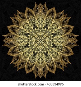 Mandala. Gold round ornament pattern on black background.