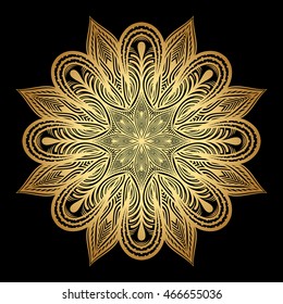 Mandala. Gold round ornament pattern on black background.