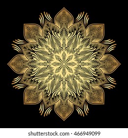 Mandala. Gold round ornament pattern on black background.