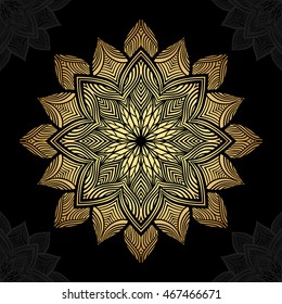 Mandala. Gold round ornament pattern on black background.