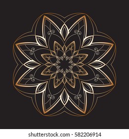 Mandala. Gold round ornament pattern on a black background.