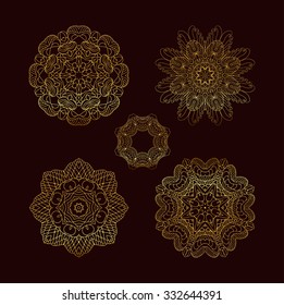 Mandala golden set. Gold Circular ornament on black background. Set of the golden patterns