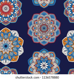 Mandala hand drawn vector seamless pattern. Colorful blue, red and orange ornate traditional background. Decorative oriental texture