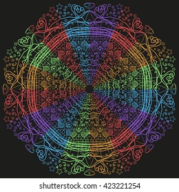 Mandala rainbow. Black background. The wheel of the winter.