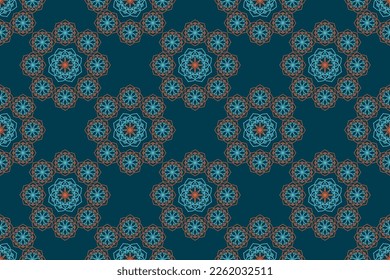 Mandala seamless pattern in green and orange colors for fabric, wallpaper, packaging.Vector illustration