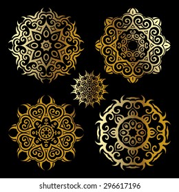 Mandala set. Gold Circular ornament on black background. Ethnic vintage pattern collection.