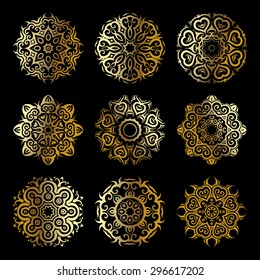 Mandala set. Gold Circular ornament on black background. Ethnic vintage pattern collection.