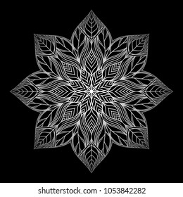 Mandala. Silver round ornament pattern on black background. 