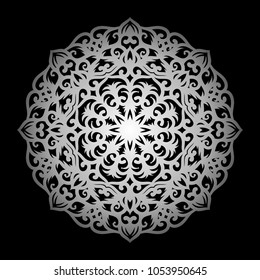 Mandala. Silver round ornament pattern on black background. 