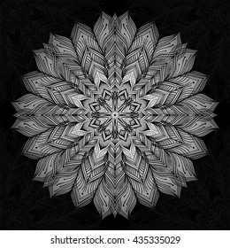Mandala. Silver round ornament pattern on black background.