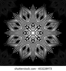 Mandala. Silver round ornament pattern on black background.