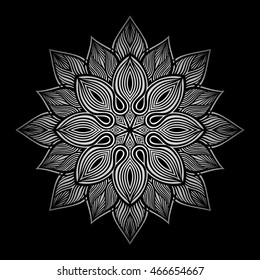 Mandala. Silver round ornament pattern on black background.