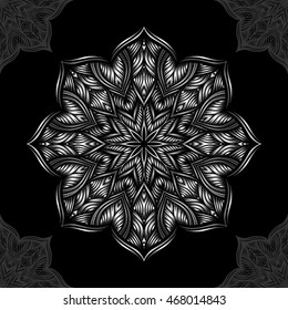 Mandala. Silver round ornament pattern on black background.