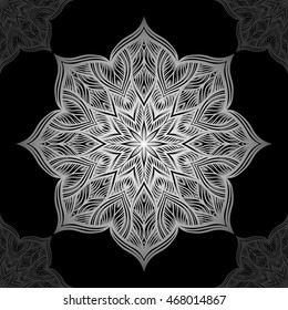 Mandala. Silver round ornament pattern on black background.