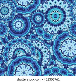 Mandala texture in bright colors. Seamless pattern on indian style. Abstract vector background