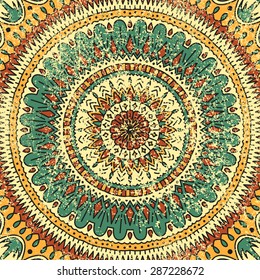 Mandala. Vector background. Green, yellow and orange colors. The circular pattern. Texture. Vintage