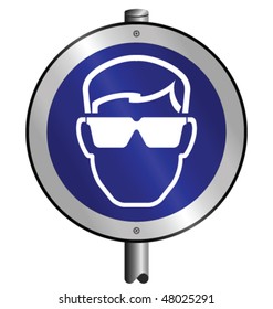 Mandatory goggles construction industry sign mounted on post