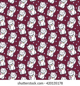 Maneki neko cat with fish seamless pattern.