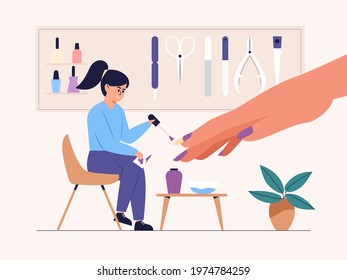 Manicurist Applies Nail Polish of client in a nail salon. She smiles and admires the professional work. 