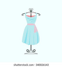 Mannequins with women's clothing. Retro blue dress