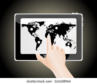 Man's finger pointing on the touch screen tablet PC with world map