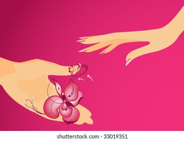 The man's hand gives a flower