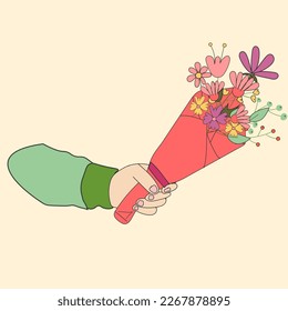 A man's hand holds a bouquet of spring flowers.