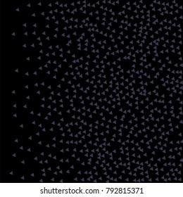 Many Blue Confetti in the Form of Triangles with Decreasing Density to the Left Side of the Picture on Black Background