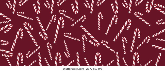 Many candy canes on dark red background. Pattern for design