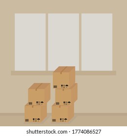 Many cardboard boxes stand by the window