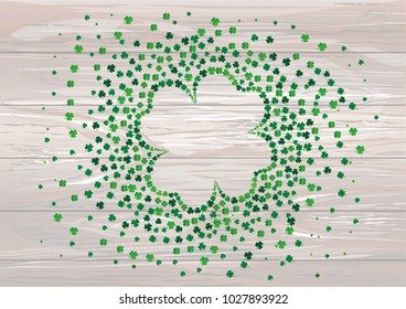 Many decorative clover. A pile of multicolored trelistnikov are on the table.St.Patrick 's Day. Vector illustration. Greeting card with empty space for text or advertising. On a wooden background.