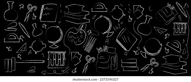 Many different drawings on black chalkboard. Back to school