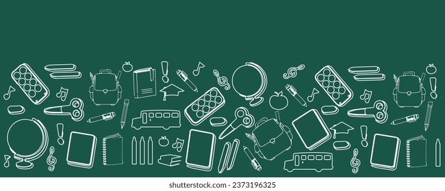 Many different drawings on green chalkboard. Back to school