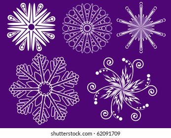 many different white snowflakes on a purple background