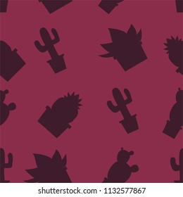 many green cactuses on the red background.