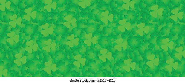 Many green shamrock leaves as background. St. Patrick's Day cele
